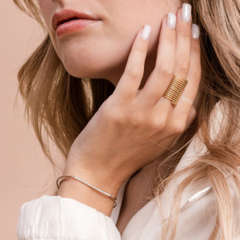 BRACCIALE IN ORO CON BARRETTA IN BRILLANTI E CORDI